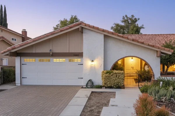 Front view of Leisure Living Properties assisted living home in Agoura Hills, California, showing the entrance and exterior with warm evening lighting.
