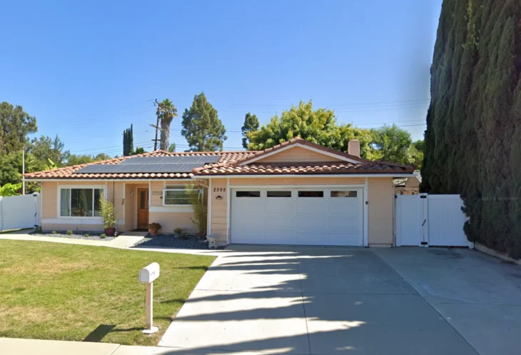 2592-ciro-ave-thousand-oaks-rcfe Exterior view of Thousand Oaks Home Care, a single-story assisted living residence located at 2592 Ciro Ave in Thousand Oaks, California, with a tiled roof, solar panels, and a neat front lawn.